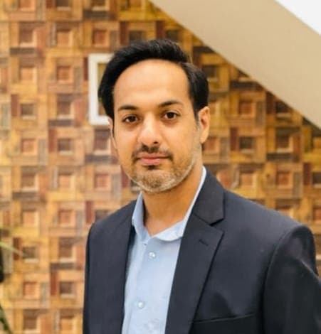Dr. Moazam Ali at the Al-Aziz Dental Clinic